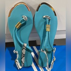 Turquoise sandals with animal print straps